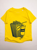 children's organic t-shirt in yellow with popcorn and colas hand printed on the front in blue water based ink