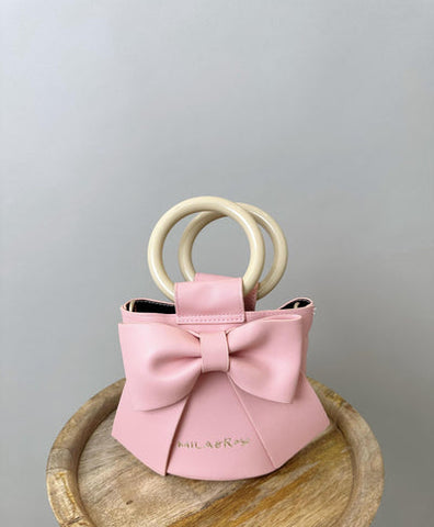 Pink corduroy lolita tote purse with white ribbon on Craiyon