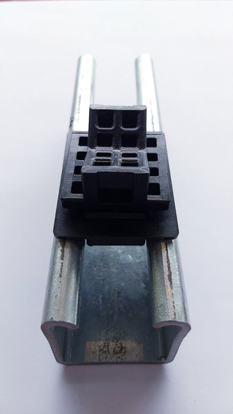 A shim used in a strut channel with Uniclamp