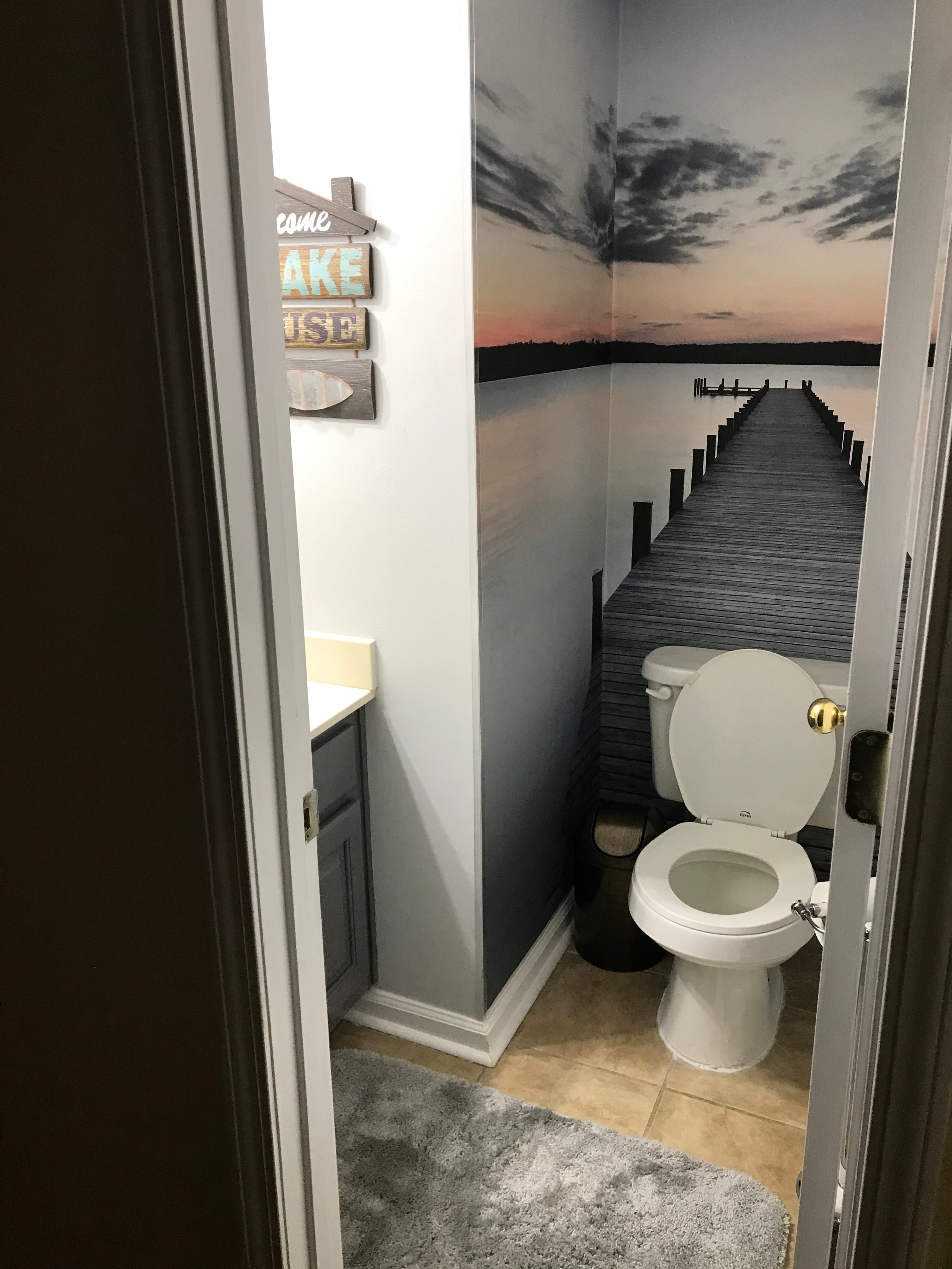 floating dock wallpaper mural in a powder room 