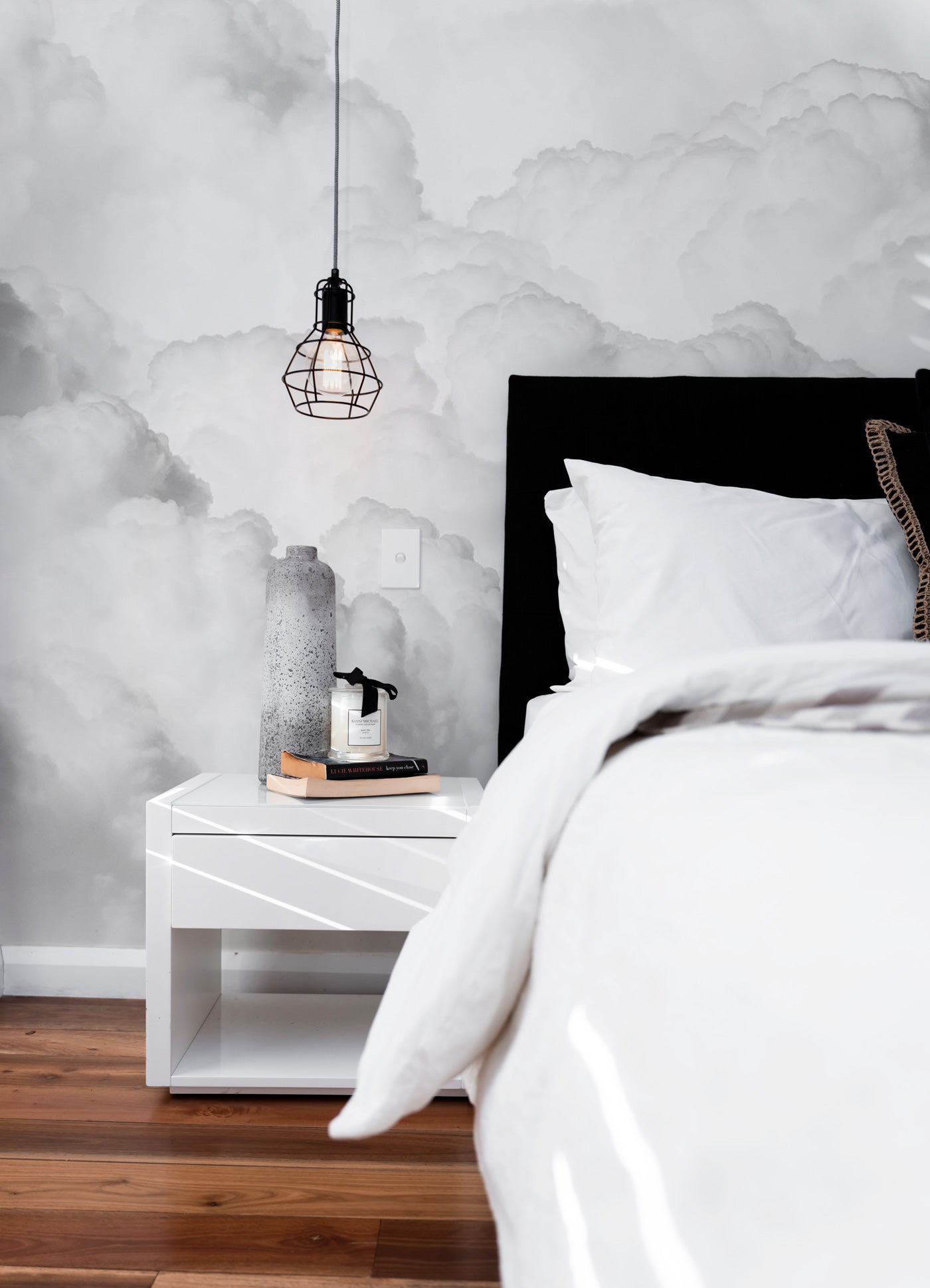 fluffy white clouds wall mural in a bedroom