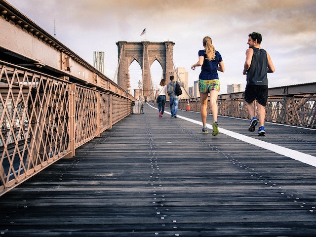 Holistic tips for radiant skin people running on bridge