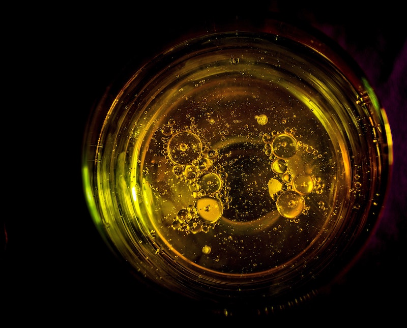 close up of the inside of a cup of canola oil