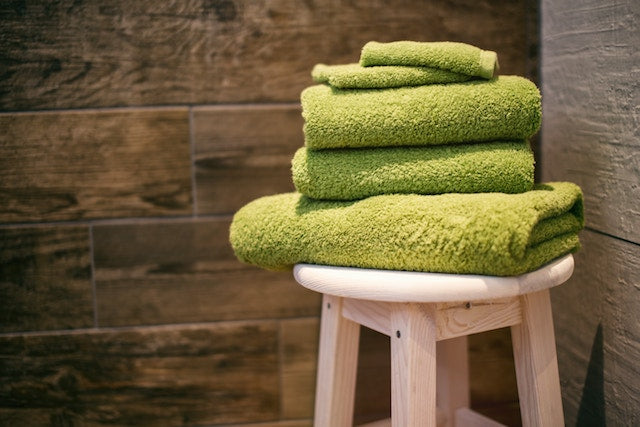 A towel on a stool outside of an infrared sauna