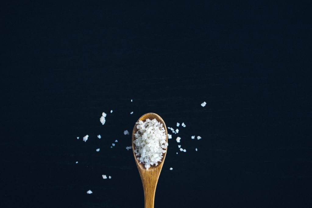 wooden spoonful of mineral-rich healthy salt 