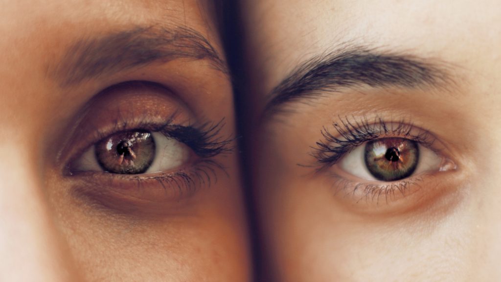 close of of two girls' eyes