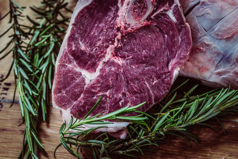 close up of raw steaks