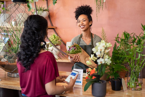 woman buying flower plants