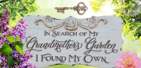 "In search of my grandmother's garden, I found my own" sign with flowers.