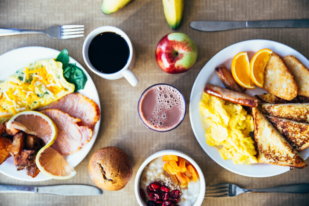 Breakfast with eggs, sausage, toast, and more