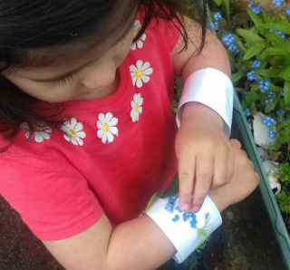 child making a nature bracelet