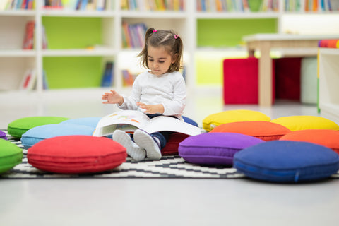 Child reading in a library 