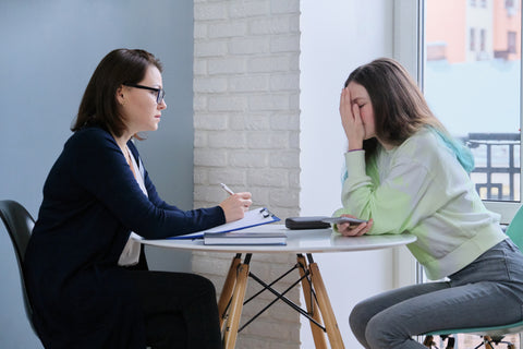 adult talking to a distressed child