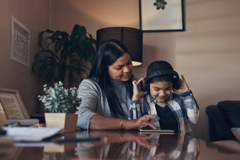 Mother and son listening to a story on a tablet