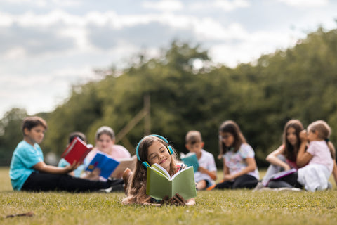 Children reading in the park