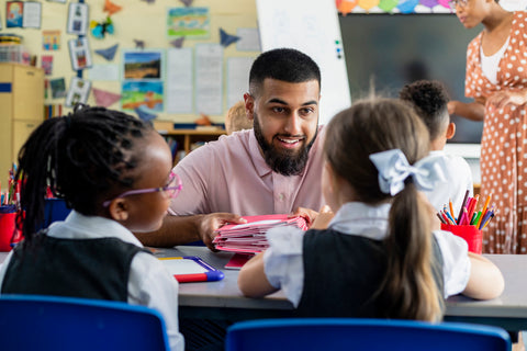 Teacher talking to children in a classroom