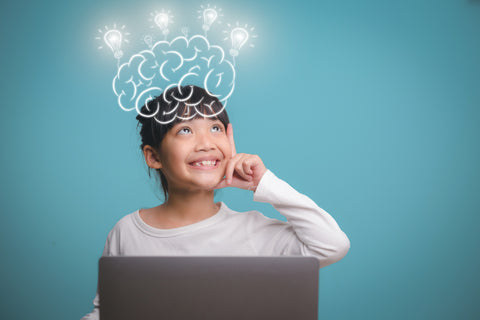 A happy girl with a lit up brain drawn over her head