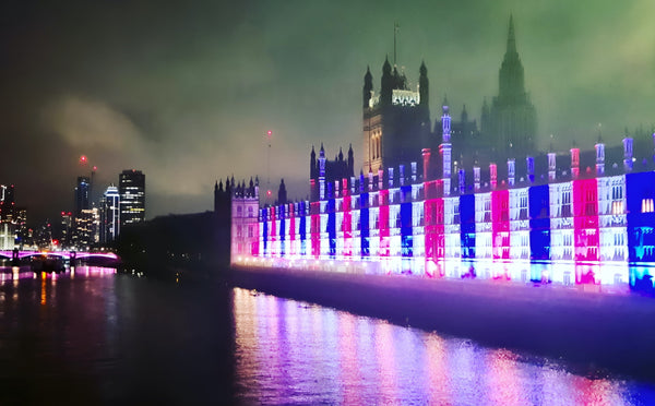Lights in London announcing coronation of the King Charles III on the 6th of May on Houses of Parliament and Big Ben