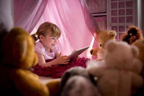 story telling with toys in a tent