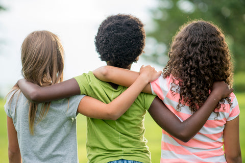 Group of children linking arms