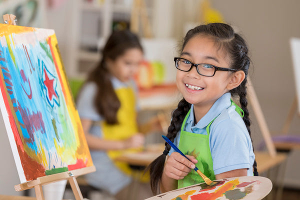 A child enjoying an art lesson