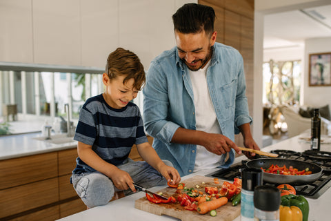 Father and son cooking together