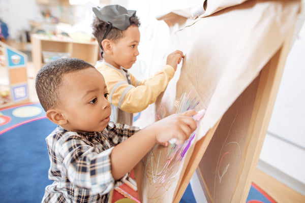 Children concentrating on their artwork