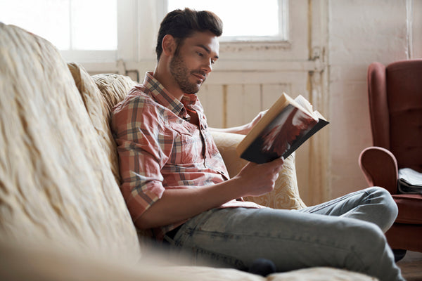 Man reading at home