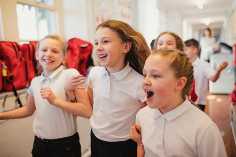 primary school children in a school hallway