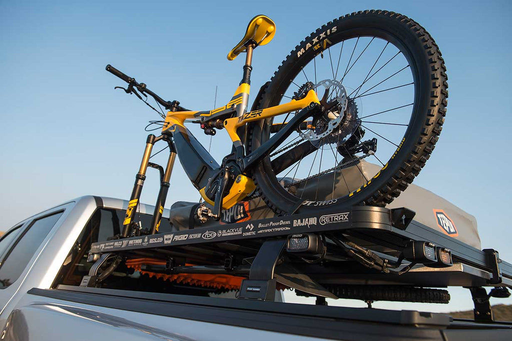 2019 ASV Ford Raptor bed rack with mounted bike, tent and tools underneath