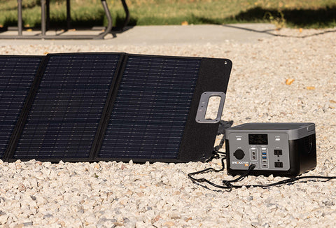 The Grid Doctor solar generator system set up outside and connected to its solar panel.