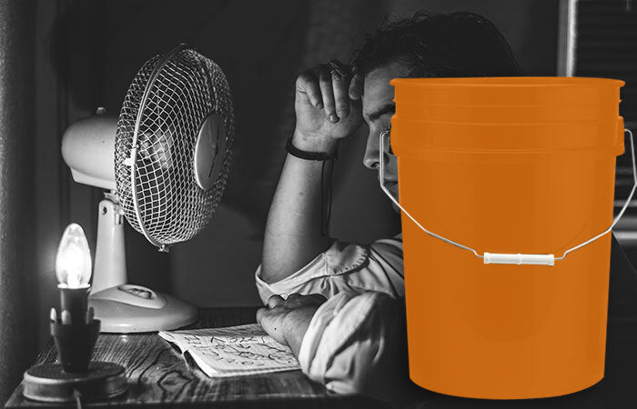 Person with a fan and bucket