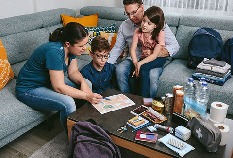 Young family reviewing an emergency plan in their home.