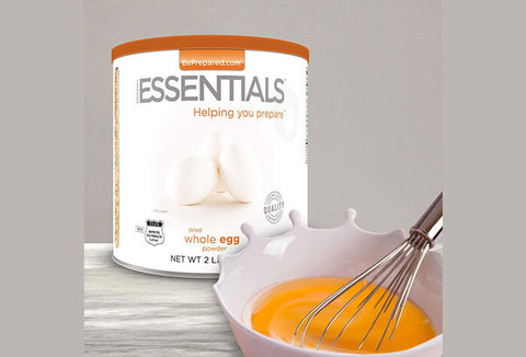 Emergency Essentials Whole Egg Powder #10 Can next to a bowl of egg yolks being whisked.