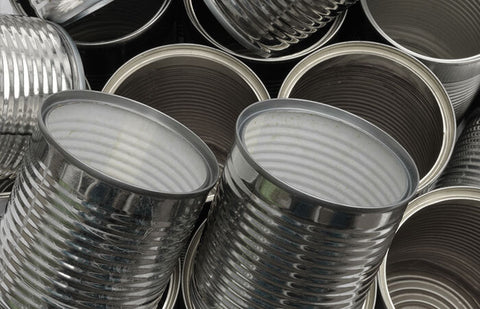 A bunch of empty steel #10 cans without lids.