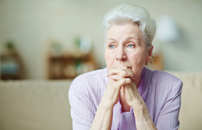 older woman looking worried