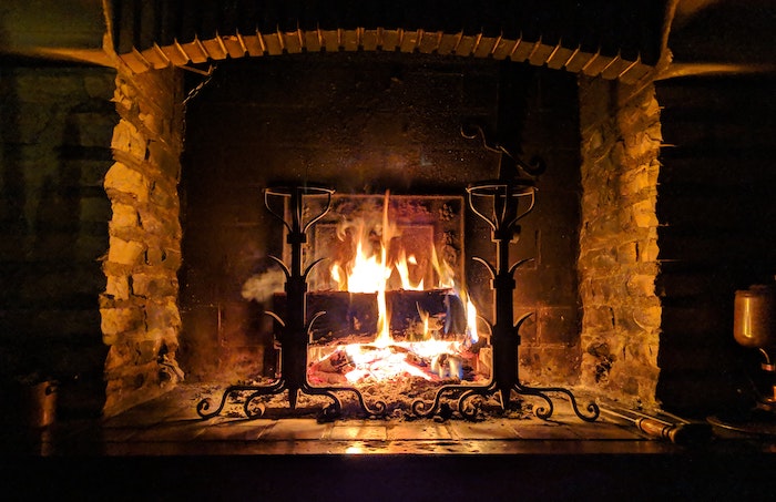 fireplace with a burning log