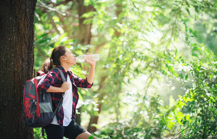 woman drinking water bottle