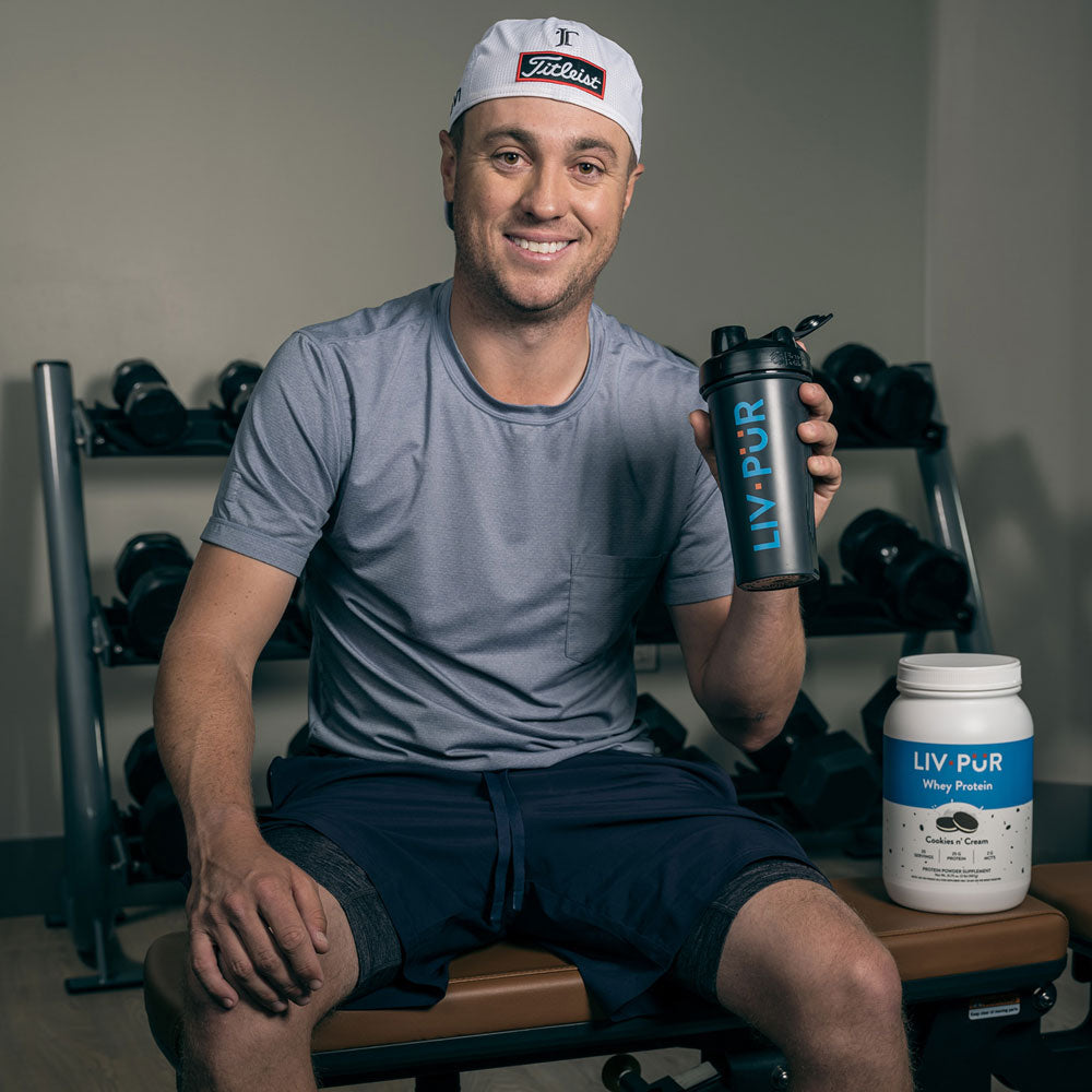 Justin Thomas on a gym bench with LivPur Whey Protein