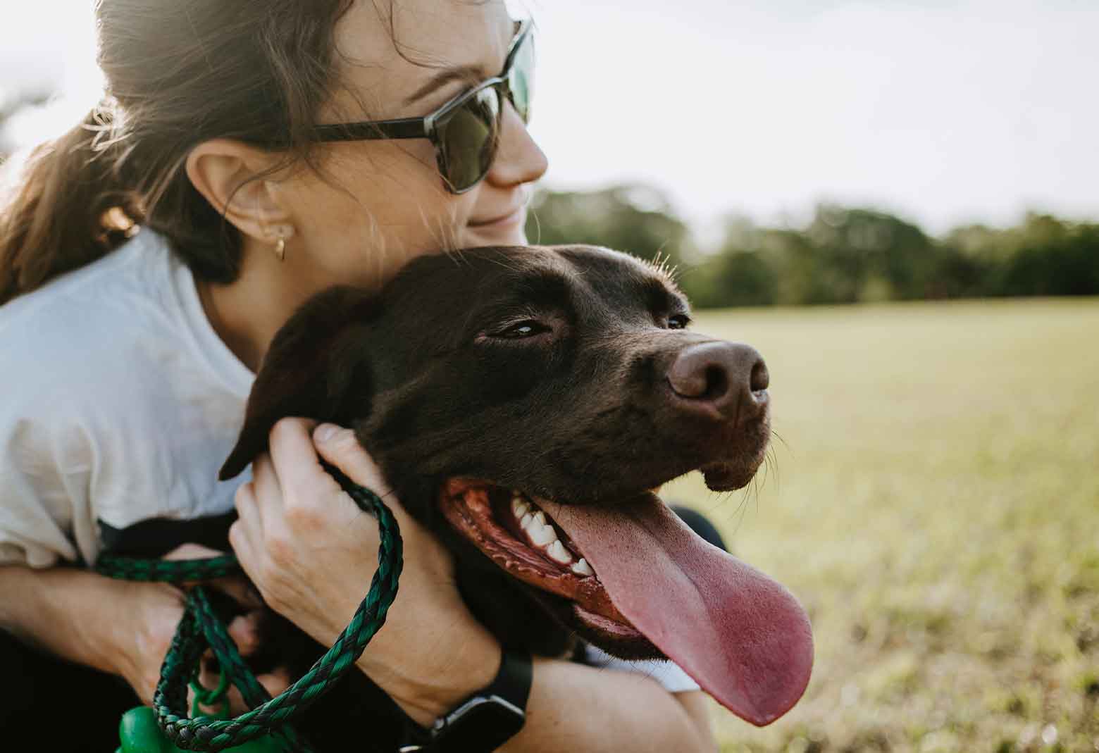 Woman Hugging Dog