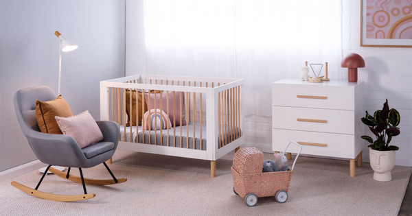 Babyrest Torquay cot and chest in natural/white, pictured in cosy nursery setting