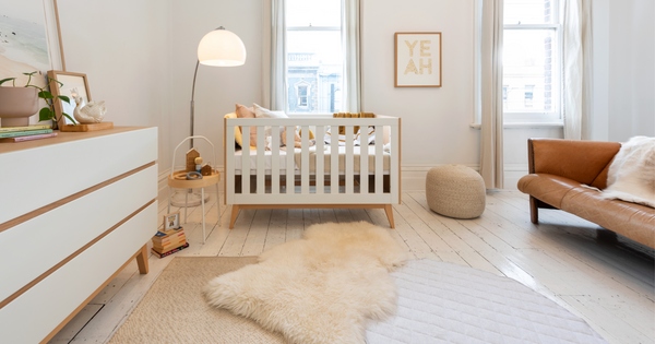 Babyrest lambskin rug in a neutral, boho nursery setting