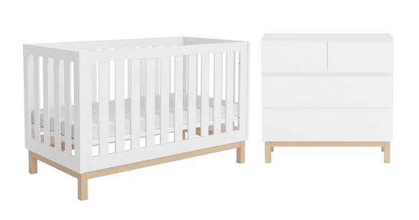 A minimalist white cot and chest duo with statement square oak legs