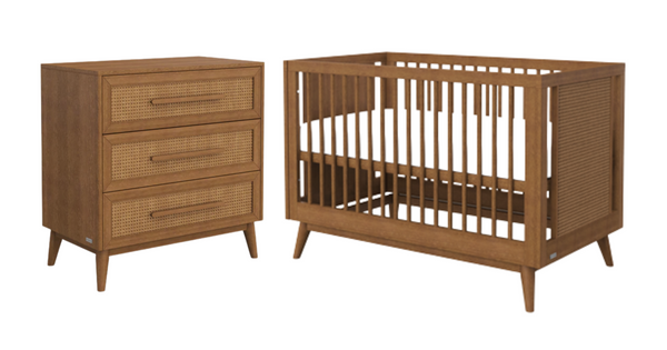 Elegant matching wooden cot and chest in a warm brown colour with tapered legs and rattan details.