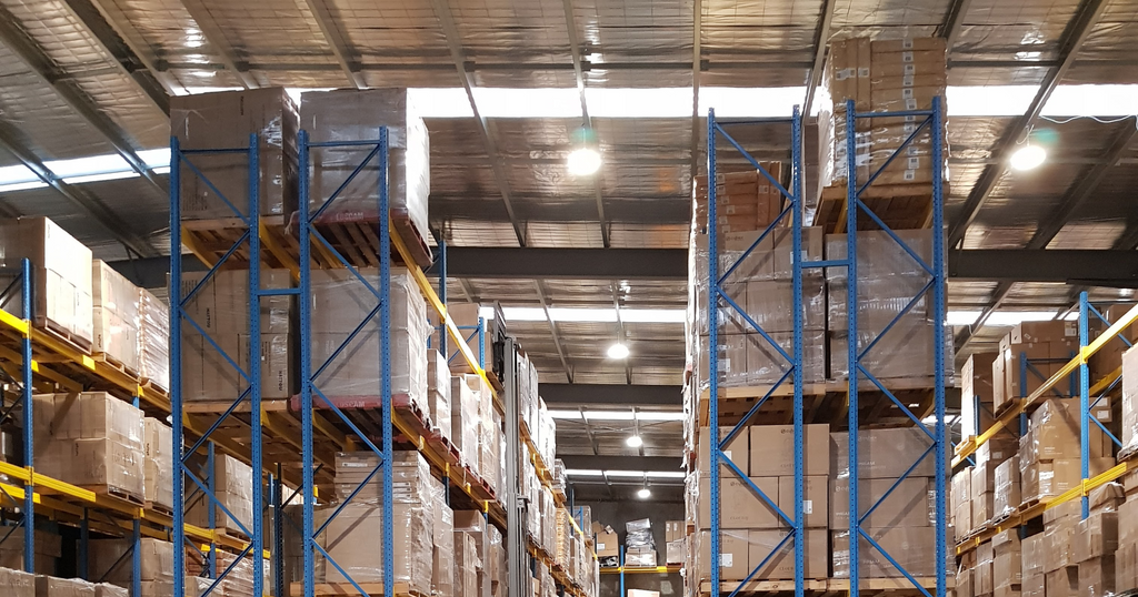 Image of tall shelves filled with boxed products in the Anstel warehouse