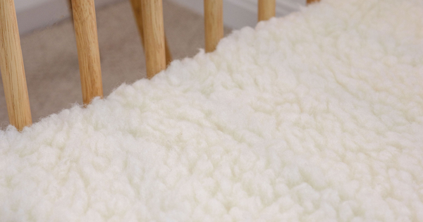 Close up of a Babyrest wool underlay inside a cot