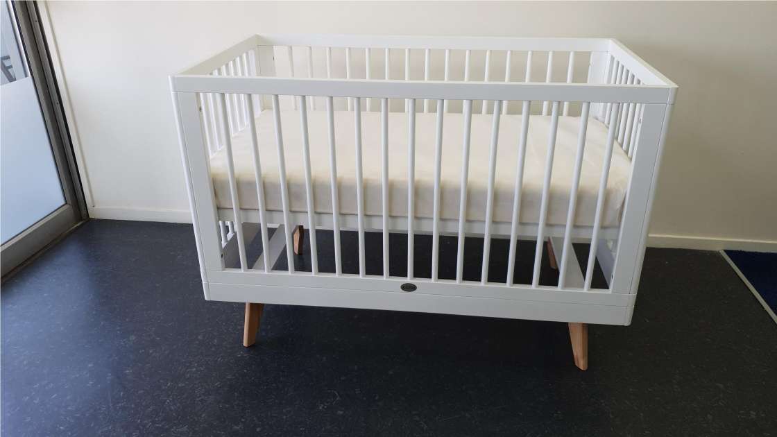 white wooden cot