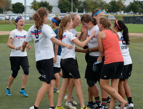 Celebrating! Either they just scored, or they're just happy to be in their new shorts!