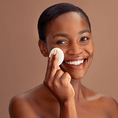 Happy woman with a face pad