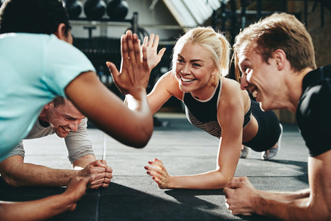 Image of woman getting a high five during a workout